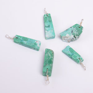 Natural variscite raw stone pendant photographed on a white background with green gemstone patterns and silver-plated finish