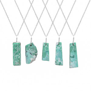 Natural variscite raw crystal bar pendant necklaces displayed in a row showing green gemstone patterns and silver-plated chains