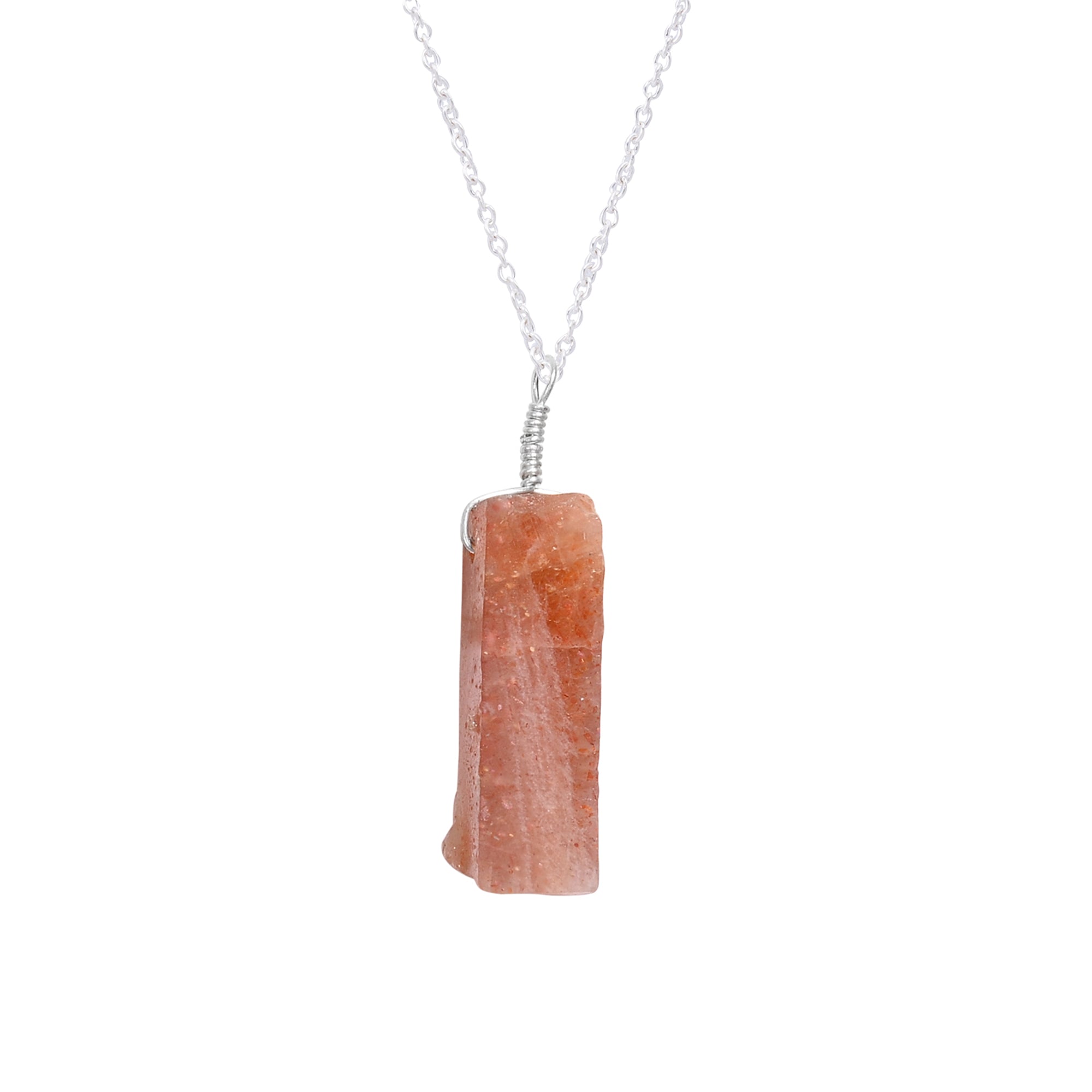 Raw sunstone bar pendant necklace shown worn on neck highlighting warm orange hues and healing energy vibes