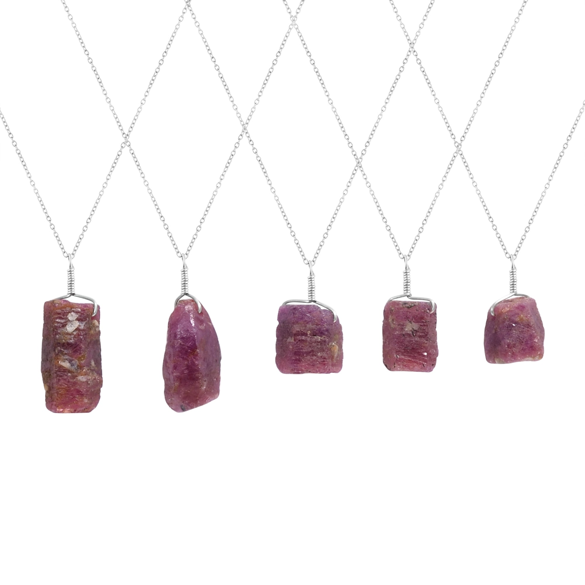 Natural ruby raw stone pendant necklaces displayed vertically showing irregular bar shapes and silver-plated chains