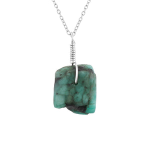 Turquoise stone necklace with silver chain on a white background