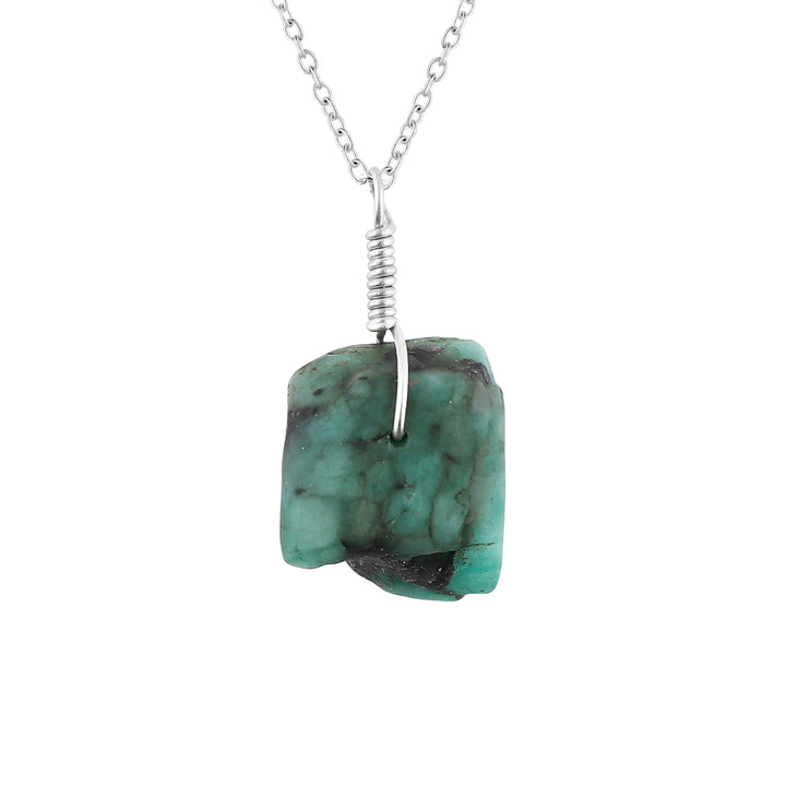 Turquoise stone necklace with silver chain on a white background