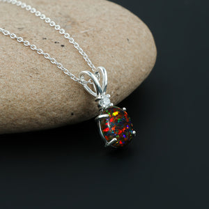 Vibrant Fire plays in a 1.3 Ct Ethiopian Opal Pendant crafted in 925 silver