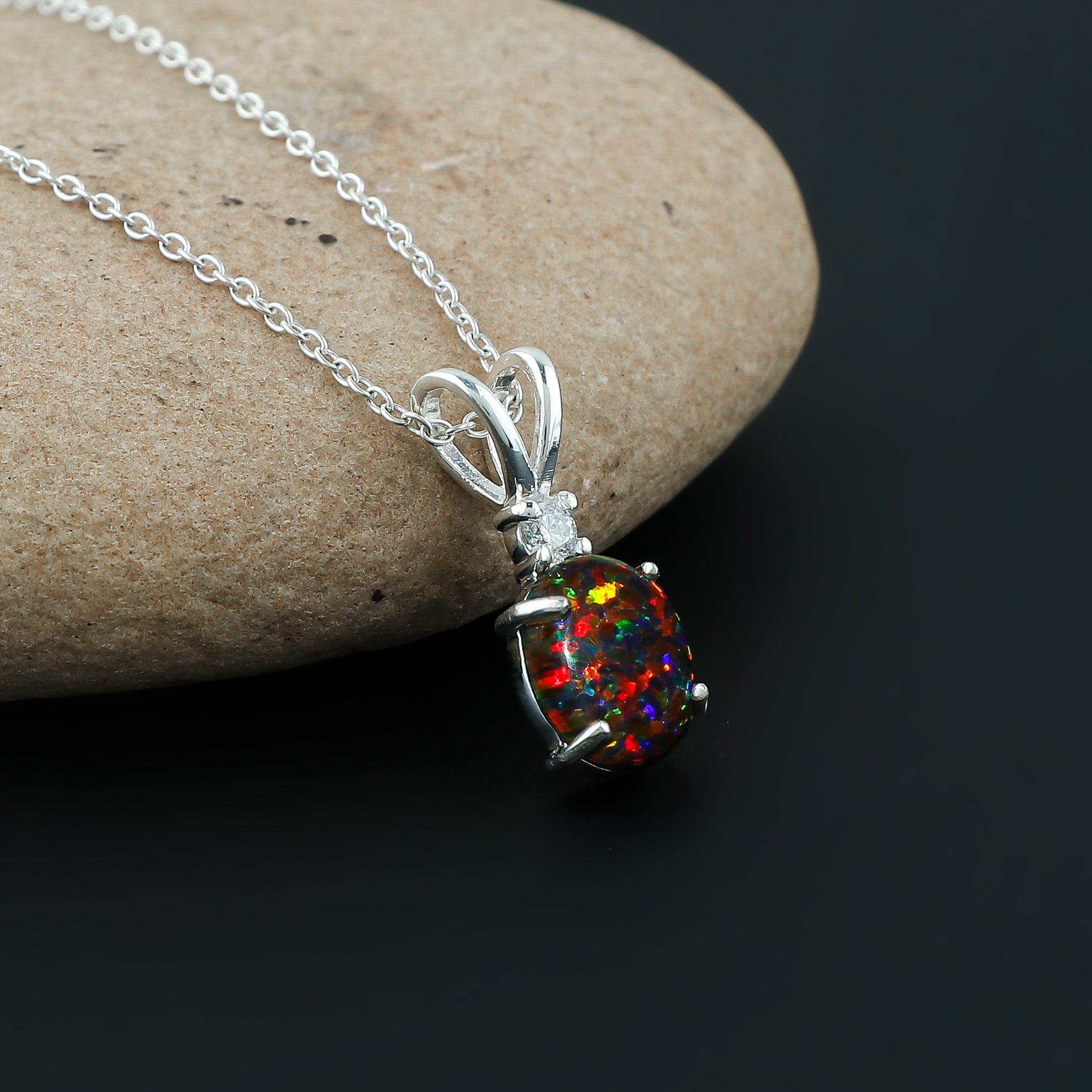 Vibrant Fire plays in a 1.3 Ct Ethiopian Opal Pendant crafted in 925 silver