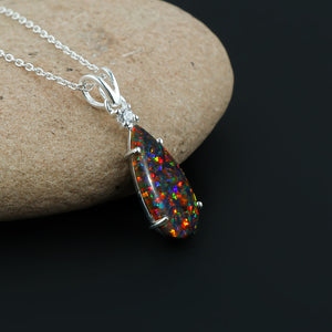 Wear the elegance and beauty with our 2.5 Ct Black Dot Ethiopian Opal Pendant mounted on 925 silver