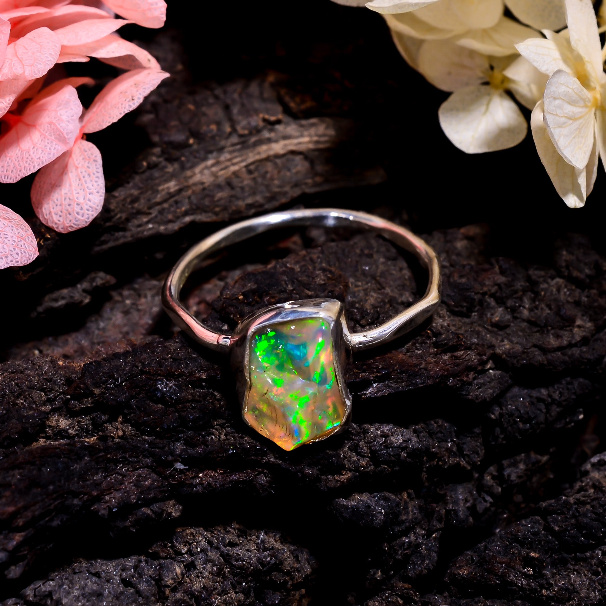 Handcrafted sterling silver ring featuring natural white Ethiopian opal