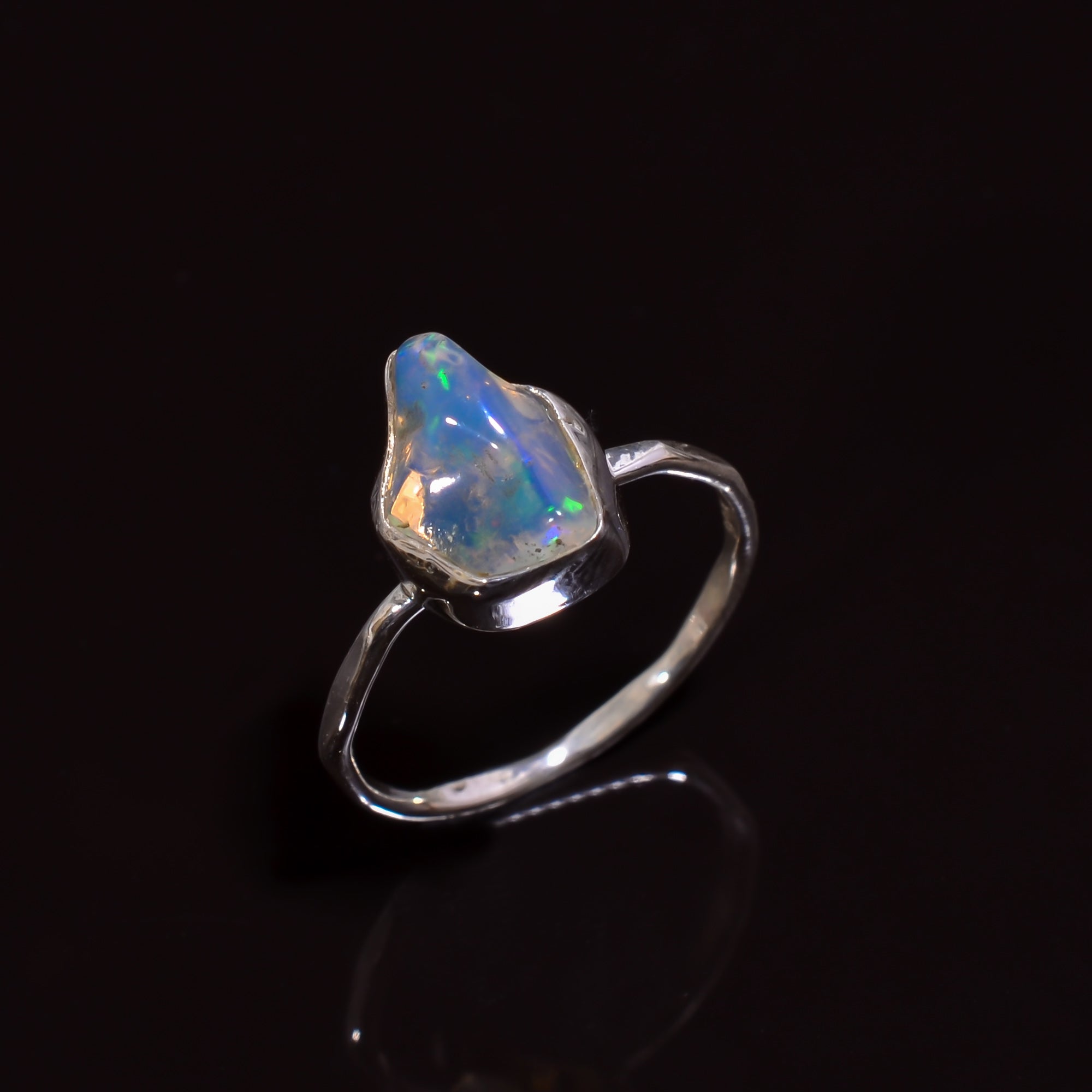 Exquisite artisan-made silver ring featuring a luminous Raw white Ethiopian opal