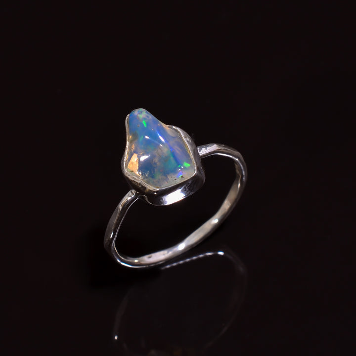 Exquisite artisan-made silver ring featuring a luminous Raw white Ethiopian opal