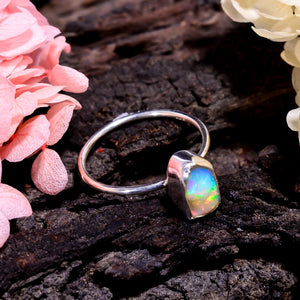 Handmade sterling silver ring featuring 10×7 mm natural white Ethiopian opal