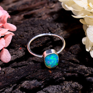 Dazzling natural opal gemstone showcased in a handcrafted sterling silver ring