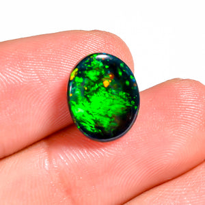Oval Shape 3 Ct Black Ethiopian Opal Cabochon Gemstone with a spectral color effect