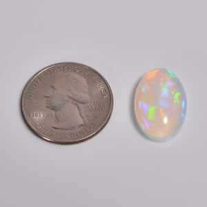 Natural loose 9.50 carat white Ethiopian opal cabochon with vibrant sparkle 
