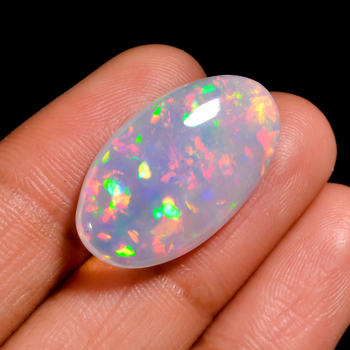 Loose 10 Ct White Ethiopian Opal stone showing vibrant fire.
