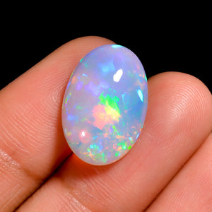 Exclusive oval white Ethiopian Opal gemstone, 5.50 carat with vivid colors 
