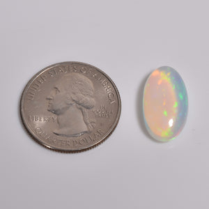 Oval-shaped 6.50 Carat White Ethiopian Opal loose Gemstone with vibrant fire play 
